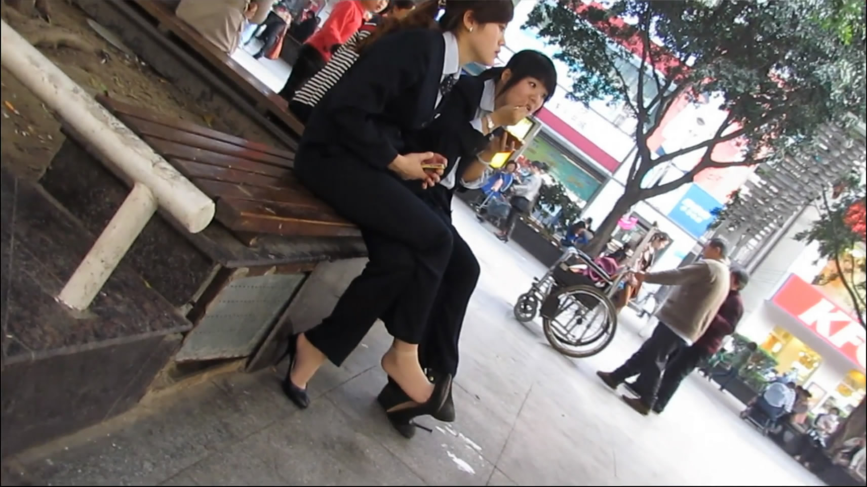 What a beauty, sitting in the park with her friend.